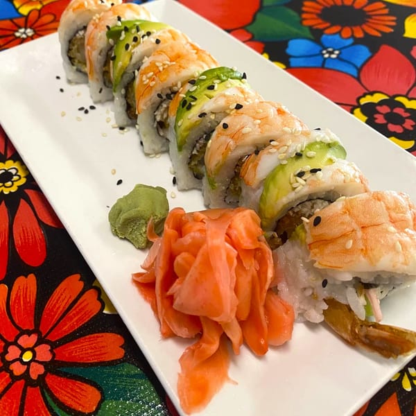 A plate of ChatRoom Restaurant's shrimp and avocado sushi rolls with wasabi and pickled ginger.